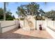 Private courtyard featuring a decorative fountain, potted plants, and tiled benches at 3412 Lilas Ct, Windermere, FL 34786