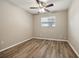 This bedroom features wood-look flooring and a ceiling fan at 353 E Orange St, Altamonte Springs, FL 32701