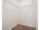 Walk-in closet with wood-look floors and metal shelving at 353 E Orange St, Altamonte Springs, FL 32701