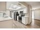 Modern kitchen featuring stainless steel appliances, white cabinetry, and a skylight at 353 E Orange St, Altamonte Springs, FL 32701