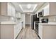 Modern kitchen with white cabinets, stainless steel appliances, and lots of natural light at 353 E Orange St, Altamonte Springs, FL 32701