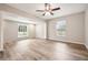 This open living room features wood floors and natural light at 353 E Orange St, Altamonte Springs, FL 32701
