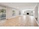 Bright living room with tile flooring, fireplace, and sliding glass doors to screened patio at 353 E Orange St, Altamonte Springs, FL 32701