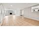 Bright living room featuring tile floors, a decorative brick fireplace, neutral paint, and ample natural light at 353 E Orange St, Altamonte Springs, FL 32701