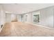 Spacious living room with tile flooring, recessed lighting, and access to outdoor spaces at 353 E Orange St, Altamonte Springs, FL 32701