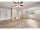 Open living space with connecting bathroom and wood-look floors at 353 E Orange St, Altamonte Springs, FL 32701