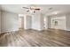 Bright living room with wood flooring, neutral walls, and an open floorplan at 353 E Orange St, Altamonte Springs, FL 32701