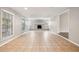 Open-concept living room featuring tile floors and white brick fireplace at 353 E Orange St, Altamonte Springs, FL 32701