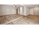 This open living room features wood floors, steps and natural light at 353 E Orange St, Altamonte Springs, FL 32701