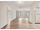Living room with wood flooring, neutral walls, ceiling fan, and plenty of natural light at 353 E Orange St, Altamonte Springs, FL 32701