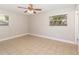 Bright bedroom featuring neutral paint, two windows, and a ceiling fan at 3675 Rundo Dr, Orlando, FL 32818