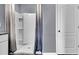 Bathroom with a white shower and a grey and white curtain at 3751 Bluethread Way, Poinciana, FL 34759