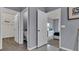 Hallway with doorways to a bathroom, bedroom, and walk-in closet at 3751 Bluethread Way, Poinciana, FL 34759