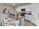 Bright kitchen featuring granite countertops, stainless steel appliances, and stylish cabinetry at 3751 Bluethread Way, Poinciana, FL 34759
