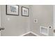 Small laundry room featuring tile floors and hookups for a washer and dryer at 3751 Bluethread Way, Poinciana, FL 34759