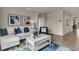 Inviting living room showcasing modern furnishings and decor with a neutral color palette and tile flooring at 3751 Bluethread Way, Poinciana, FL 34759