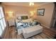 Cozy bedroom with a queen-size bed, matching lamps, and a bench at the foot of the bed at 4153 S Atlantic Ave # 1070, New Smyrna Beach, FL 32169