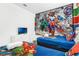 themed bedroom featuring Marvel characters, and two beds featuring vibrant colorful bedding and a white dresser at 4164 Paragraph Dr, Kissimmee, FL 34746