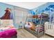 Charming ' bedroom with whimsical decor, bunk beds, and ample sleeping space at 4164 Paragraph Dr, Kissimmee, FL 34746