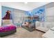 Charming ' bedroom with whimsical decor, bunk beds, and ample sleeping space at 4164 Paragraph Dr, Kissimmee, FL 34746