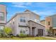 Modern two-story home featuring stone accents and a well-maintained lawn at 4164 Paragraph Dr, Kissimmee, FL 34746