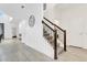 Inviting foyer with tiled floors, staircase, and a view into adjacent living spaces at 4164 Paragraph Dr, Kissimmee, FL 34746
