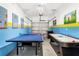 Finished garage featuring painted walls, a ping pong table, and an air hockey table at 4164 Paragraph Dr, Kissimmee, FL 34746