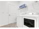 Convenient laundry room featuring modern appliances and ample storage space at 4164 Paragraph Dr, Kissimmee, FL 34746