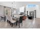 Open-concept living and dining with modern decor, ample seating, and natural light at 4164 Paragraph Dr, Kissimmee, FL 34746