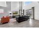 Bright living room with high ceilings, stylish furniture, and view to the pool at 4164 Paragraph Dr, Kissimmee, FL 34746