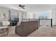 Upstairs living room with comfortable seating, a large window, and modern decor elements at 4164 Paragraph Dr, Kissimmee, FL 34746