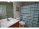 Traditional-style bathroom with a single sink vanity, toilet, and a shower/tub combination at 4175 Sw 46Th Ct, Ocala, FL 34474