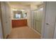 Bright bathroom features a double sink vanity and a glass-enclosed shower at 4175 Sw 46Th Ct, Ocala, FL 34474