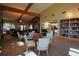 Inviting clubhouse lounge area with high ceilings, exposed beams, and a cozy seating arrangement at 4175 Sw 46Th Ct, Ocala, FL 34474