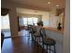 View of kitchen counter and bar stool seating overlooking backyard at 4175 Sw 46Th Ct, Ocala, FL 34474