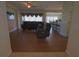Spacious living room featuring hardwood floors and seamlessly connecting to the kitchen and dining area at 4175 Sw 46Th Ct, Ocala, FL 34474