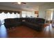 Open-concept living room boasts hardwood floors and a comfortable sectional, ideal for gatherings at 4175 Sw 46Th Ct, Ocala, FL 34474