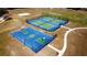 Aerial view of basketball and tennis courts in a well-maintained community space at 4175 Sw 46Th Ct, Ocala, FL 34474