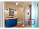 A well-lit bathroom showcasing a blue vanity and shower with glass door at 429 E Gore St, Orlando, FL 32806