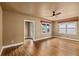 Hardwood floors, white trim, and a ceiling fan in this lovely living room at 429 E Gore St, Orlando, FL 32806