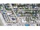 Birds eye shot showcasing neighborhood near the ocean with well-maintained homes, green lawns, and nearby shops at 435 Jessamine Ave, New Smyrna Beach, FL 32169