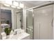 Bright bathroom with a glass-enclosed shower and a view of the main bedroom at 435 Jessamine Ave, New Smyrna Beach, FL 32169