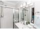 Bright bathroom with a glass-enclosed shower and a modern vanity at 435 Jessamine Ave, New Smyrna Beach, FL 32169