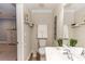 Bathroom featuring a toilet, sink, faucet, mirror, and decorative plants on the counter at 435 Jessamine Ave, New Smyrna Beach, FL 32169