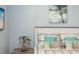 Comfortable bedroom with a palm tree theme decor including a headboard, wall art, and bedding at 435 Jessamine Ave, New Smyrna Beach, FL 32169