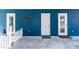 Stunning home exterior featuring a vibrant blue color scheme and unique wood accent at 435 Jessamine Ave, New Smyrna Beach, FL 32169