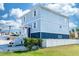 Beautiful two-story home with a well-manicured lawn, white picket fence, and ample parking at 435 Jessamine Ave, New Smyrna Beach, FL 32169