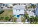 Beautiful two-story home featuring a modern design, a blue front door, and a well-maintained landscaped yard at 435 Jessamine Ave, New Smyrna Beach, FL 32169