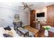 Living room featuring a desk, mini-kitchenette, sleek furniture, and light wood-look flooring at 435 Jessamine Ave, New Smyrna Beach, FL 32169