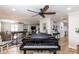 Open-concept living area featuring wood floors, a baby grand piano, and seamless flow to other spaces at 435 Jessamine Ave, New Smyrna Beach, FL 32169